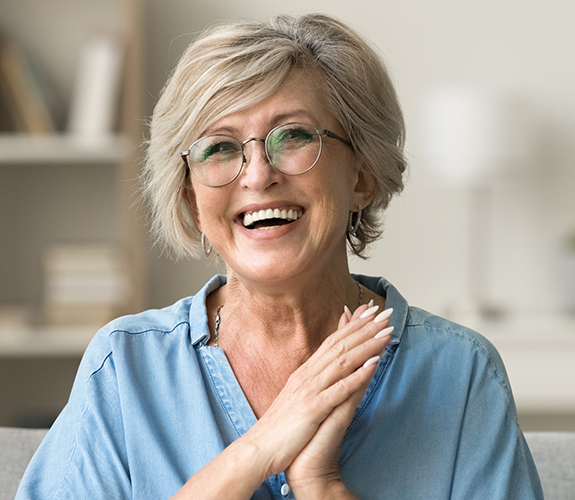 Smiling older woman in a denim blouse